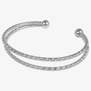 Detail of silver dual-layer stainless steel bangle with diamond-cut texture and metal beads