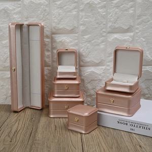 Rose gold jewelry box set with gold crown emblem on premium PU leather finish