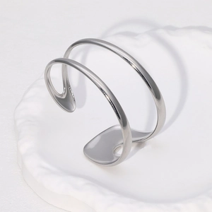 Minimalist silver-tone stainless steel open bangle featuring a modern double-line design