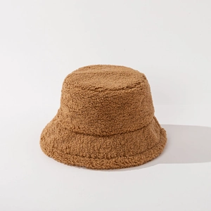 Detailed texture of thick caramel brown fleece bucket hat for winter warmth