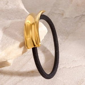 Minimalist gold stainless steel hair tie featuring a polished curved metal decoration