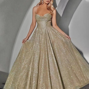Elegant gold sequin tube top maxi dress with a flowing large skirt for evening parties