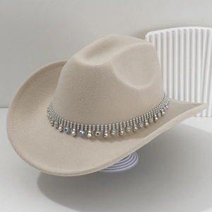 Beige western cowboy hat with silver rhinestones and metal rivets on a grey felt band