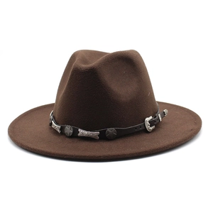Macro shot of dark brown felt fedora with a Western-style leather band and silver buckle