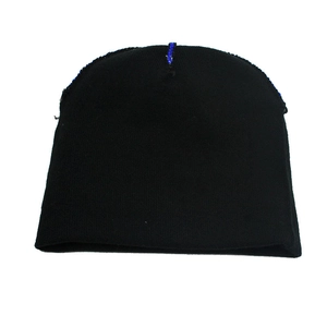 Detailed texture of black knit Christmas hat showing ribbed cuff and soft wool weave
