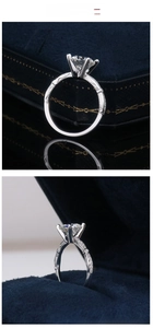Detailed side view of 7.5mm moissanite ring with six-prong setting in blue velvet box
