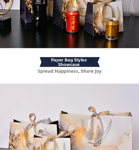 Detail of marble pattern gift bag with satin ribbon and Happy Times text on a black surface