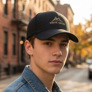 Black cotton baseball cap featuring gold mountain embroidery and YOUTH DAYOFF text design