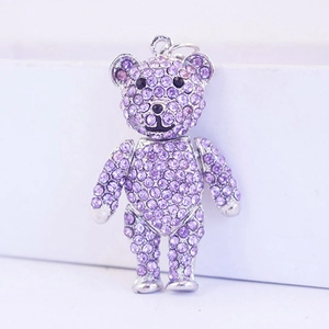 Sparkling purple rhinestone crystal bear keychain with silver metal clip on white background