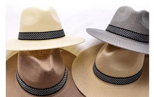 Detailed view of woven Panama hats in four colors with geometric pattern bands