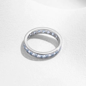 Elegant s925 sterling silver eternity ring with square blue crystal gems on white background