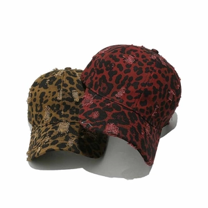 Distressed leopard print baseball caps in red and brown canvas with ripped details
