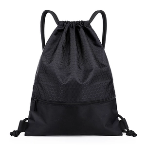 Waterproof nylon drawstring bag in black with honeycomb texture and front zipper pocket