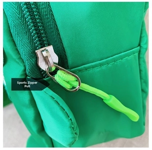 Close-up of vibrant green bag sports zipper pull with metallic head and nylon cord