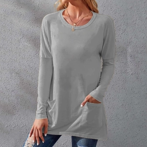Detail shot of a grey long sleeve t-shirt featuring functional side pockets and loose fit