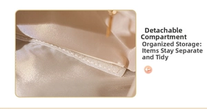 Detail of the large checkered makeup bag interior with a removable Velcro divider