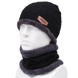 Women's black knit hat and neck warmer set with thick faux fur lining for winter warmth