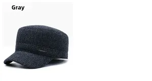 Detail of dark grey winter military cap showing thick textured fabric and metal Sport tag