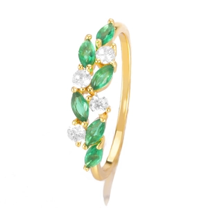 Close-up of gold ring with marquise-cut green gems and white zircon in a leaf-like design