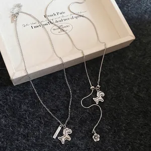 Silver S925 necklace set with lucky horse pendants and zircon on black knit background