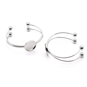 Double-layer C-shaped stainless steel bangle with open cuff and round bezel trays