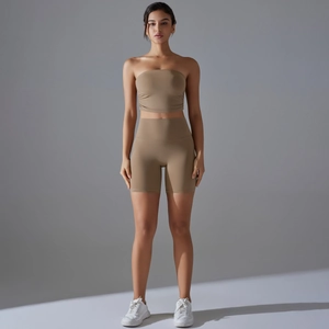 Detail of khaki two-piece yoga set with seamless crop top and high waist biker shorts