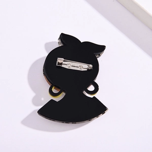 Modern black acrylic brooch featuring a silhouette design with a secure silver metal clasp