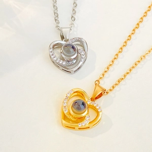 Gold and silver heart projection necklaces with 100 languages I Love You and CZ stones