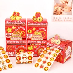Macro detail of red reward sticker rolls with cartoon motifs like smiles and flowers