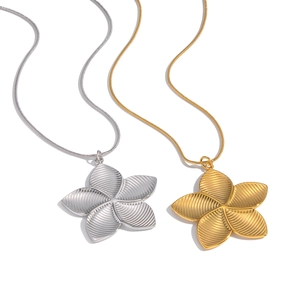 French vintage flower pendant necklace in gold and silver textured stainless steel