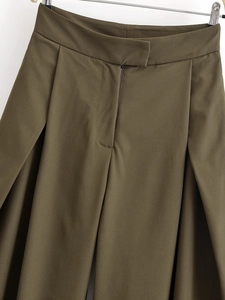 Detailed view of olive green high waisted wide leg trousers with pleated waist design