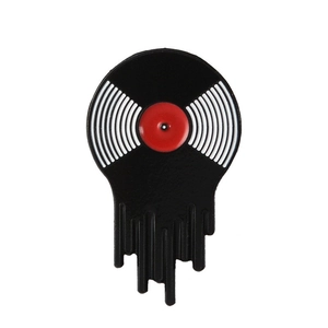 Close-up of a melting vinyl record enamel pin in black and red music series design