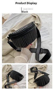 Close-up of black leather chest bag featuring silver studs and metallic fringe details