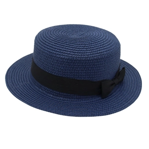 Navy blue straw boater hat with a black ribbon bow for summer beach sun protection