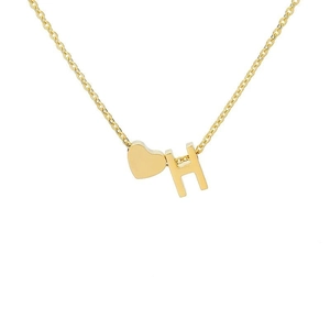 Close-up of 18k gold plated stainless steel necklace with heart and H letter pendants