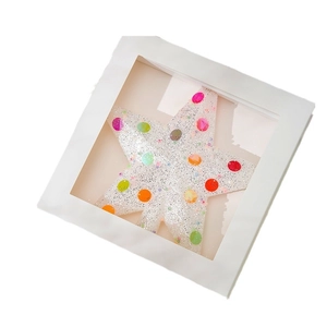 Boîte étoile de Noël décorative avec pois colorés et finition à paillettes blanches
