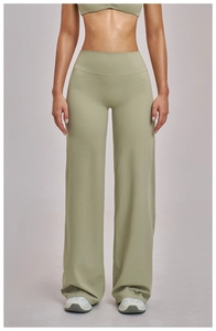 Front view of high waist wide leg yoga pants in light sage green with matching tank top