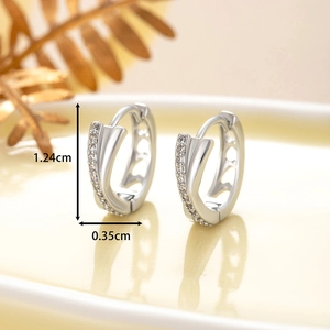 Silver criss-cross hoop earrings with clear cubic zirconia crystals measuring 1.24cm by 0.35cm