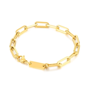 Golden stainless steel paperclip link bracelet with rectangular tag on white background