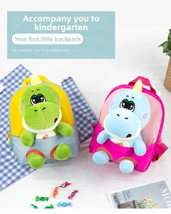 Detail van waterdichte dinosaurusrugzak voor kinderen met afneembare knuffelpop