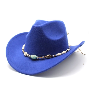 Detail of royal blue cowboy hat featuring an ethnic beaded band with shells and beads