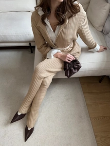 Detail of khaki ribbed knit two-piece set featuring a lapel cardigan and wide-leg pants