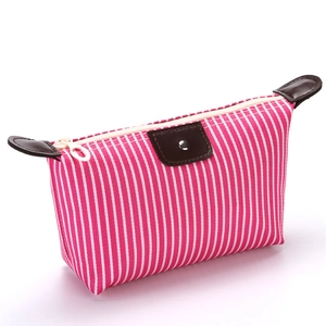Pink and white striped cosmetic bag with brown leather zipper detail and handle