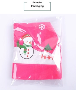 Detailed view of red Christmas car seat headrest cover with snowman print in plastic packaging