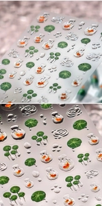 Macro detail of 3D goldfish and lotus leaf nail stickers with realistic water drops