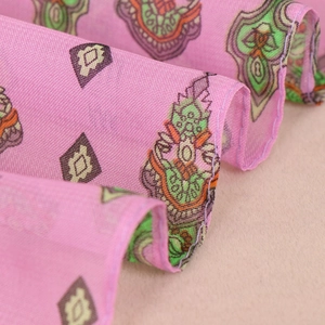 Close-up of lightweight chiffon scarf showing breathable texture and bohemian patterns