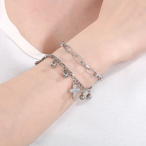 Close-up of double-layer stainless steel cross pendant bracelet with rectangle links