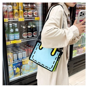 Close-up of sky blue 2D cartoon shoulder bag with bold black outlines and adjustable strap