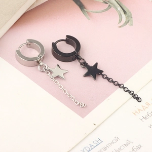 Detailed view of silver and black stainless steel hoop earrings with star charms and chains