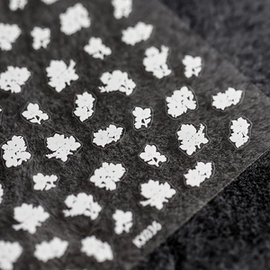 Self-adhesive 5D flower nail stickers KX036 with white floral patterns on dark plush